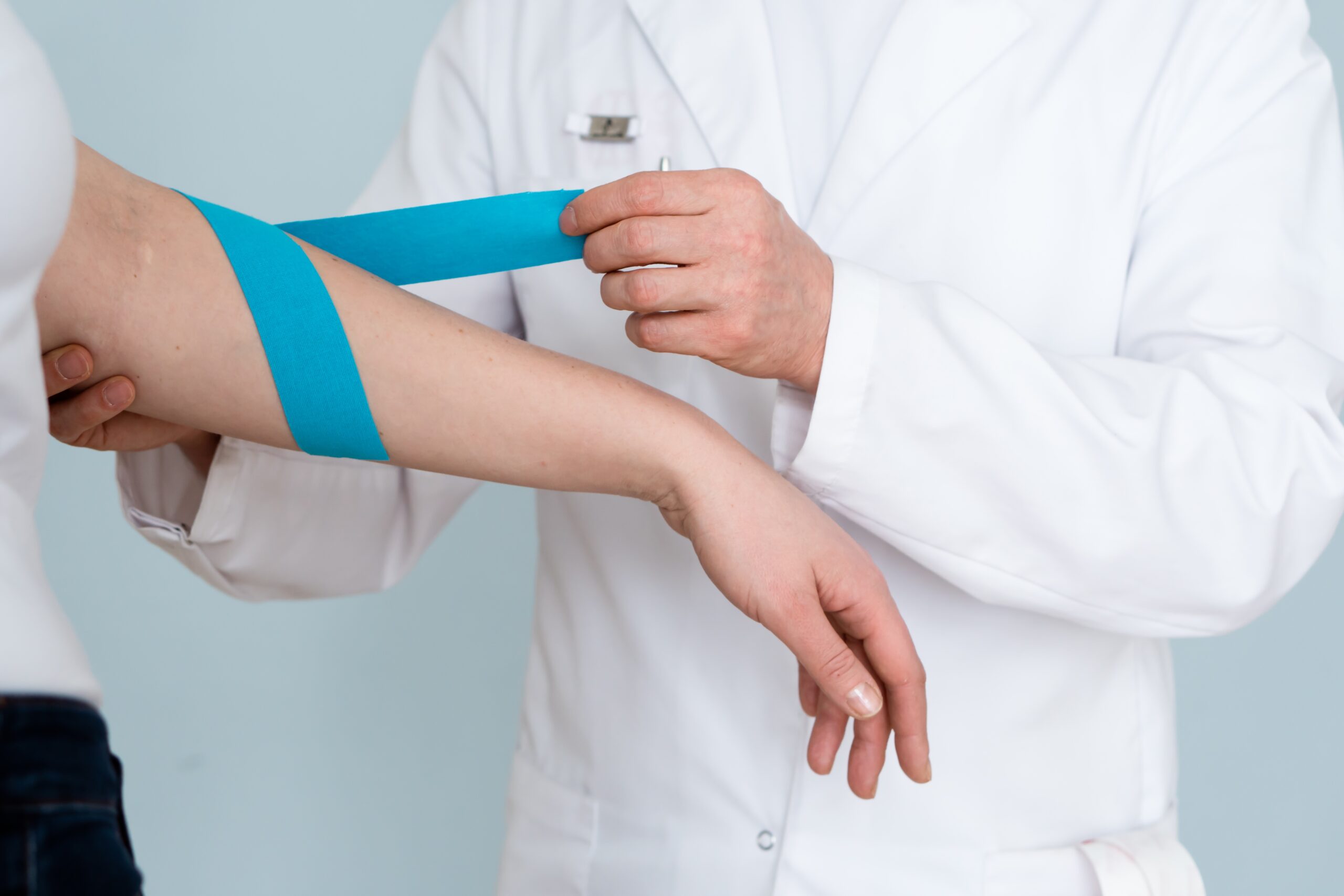 doctor-and-patient-kinesio-tape-application-on-ha-2025-03-08-07-40-41-utc